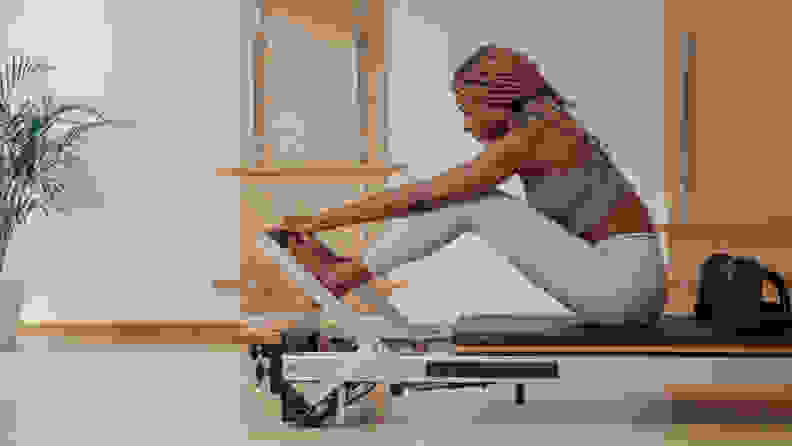 woman on a pilates reformer