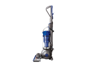 Four vacuums on a wooden floor in front of a wall