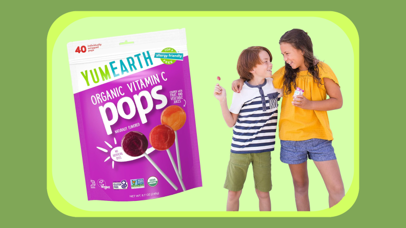 Resealable bag of organic YumEarth lollipops next to two children embracing each other while holding lollipops.