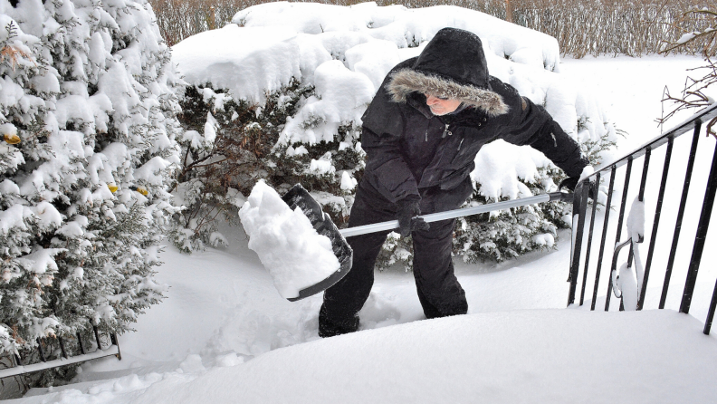 shoveling snow off stairs