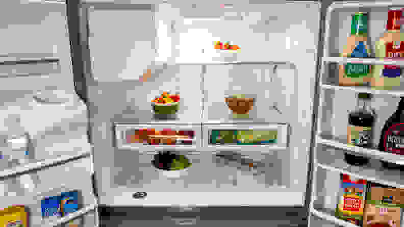 A shot of the interior of the Whirlpool WRX735SDHZ French door refrigerator, filled with food for scale.