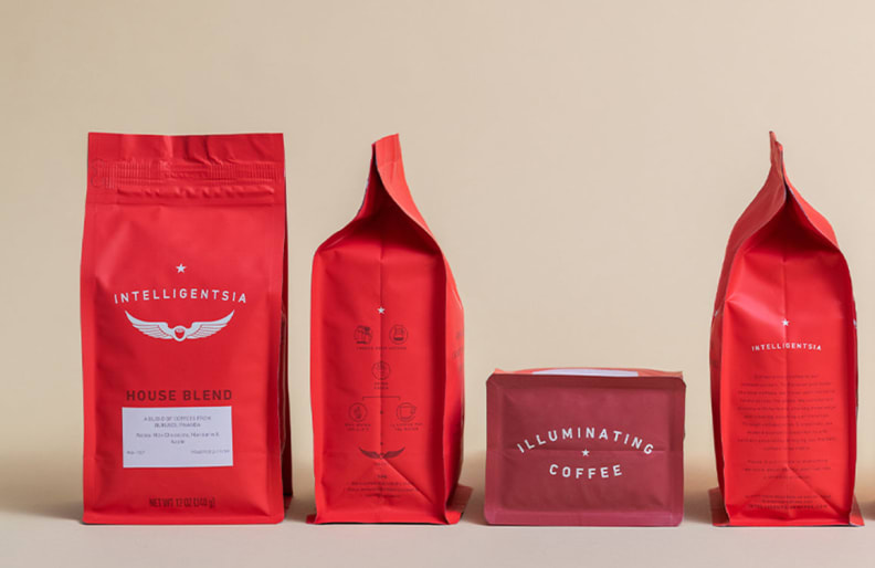 Four Intelligentsia bags of coffee laid out beside each other