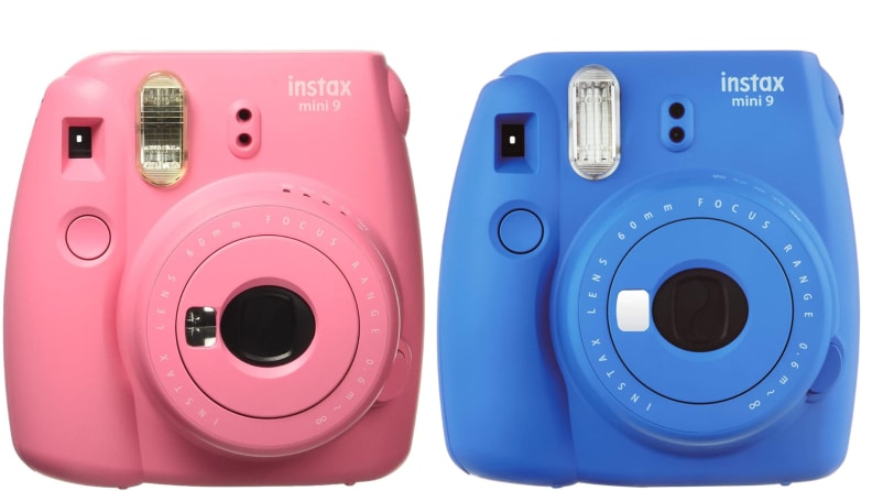 Two pink and blue Fujifilm polaroid cameras side by side.