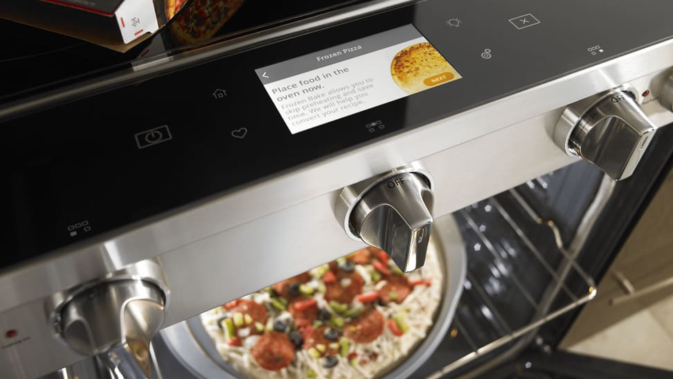 A smart oven with a pizza pie inside.