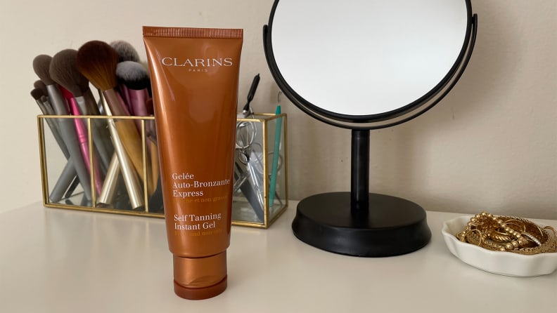 The Clarins Self Tanning Instant Gel self-tanner sitting on a vanity.