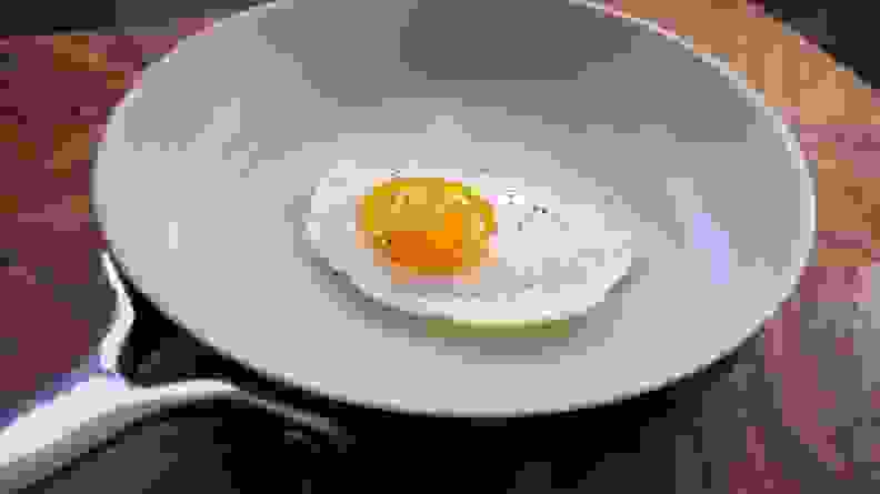 An egg frying in the Equal Parts frying pan.