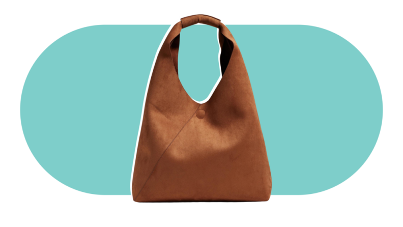 An oversized brown leather faux leather tote bag.