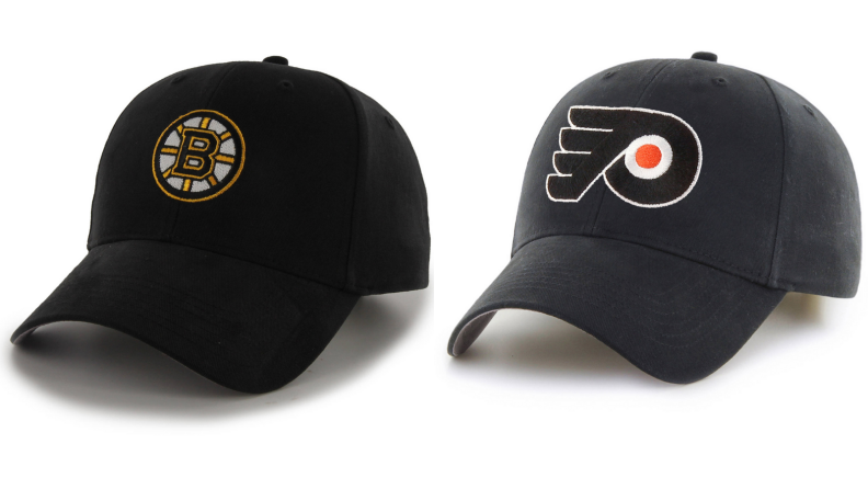 Bruins cap next to a Flyers cap