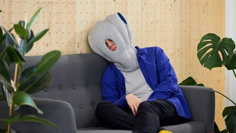 Person with Ostrich pillow on head.