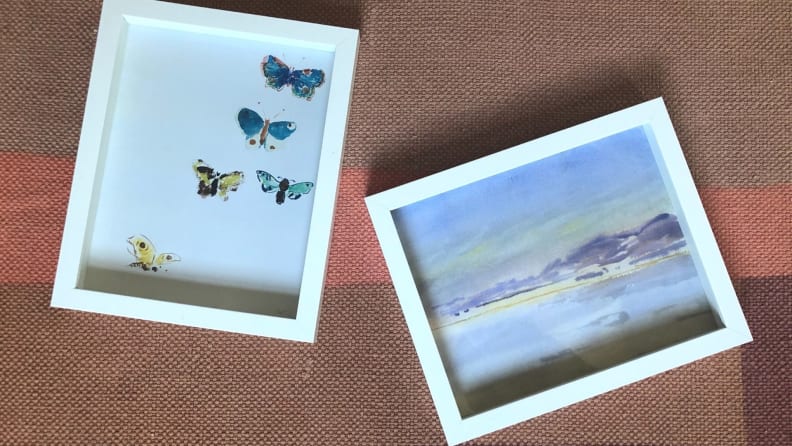 Framed prints of butterflies and purple landscape