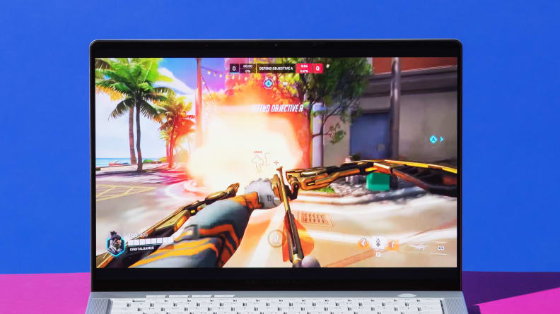 The laptop displaying gameplay of Overwatch 2.