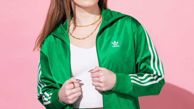 woman wearing adidas green track jacket
