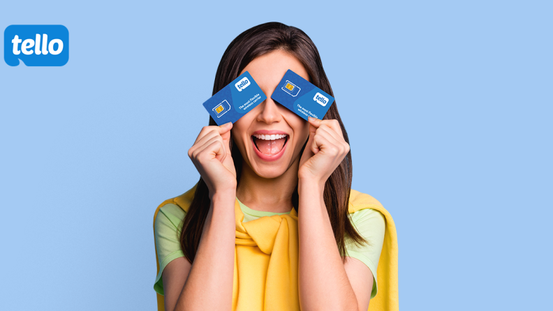 Woman holding credit cards in front of her eyes