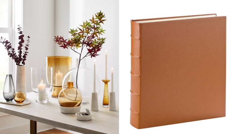 On left, assorted glass candle holders on table. On right, tan leather bound book.