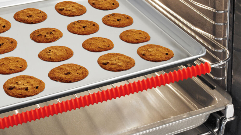 Tray of cookies in an oven with an oven rack guard