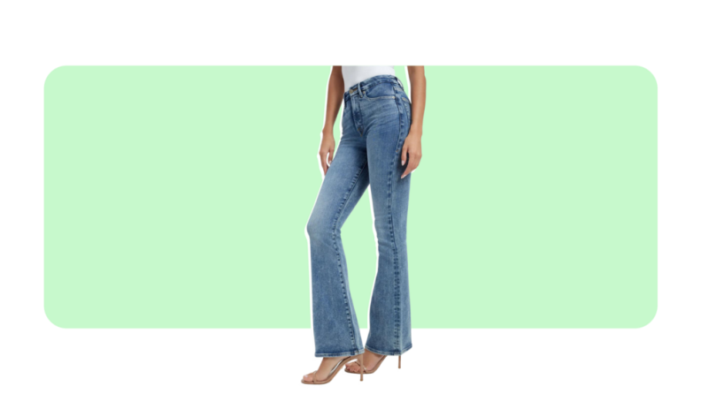 A pair of medium-wash flare leg jeans worn with a stiletto heel.