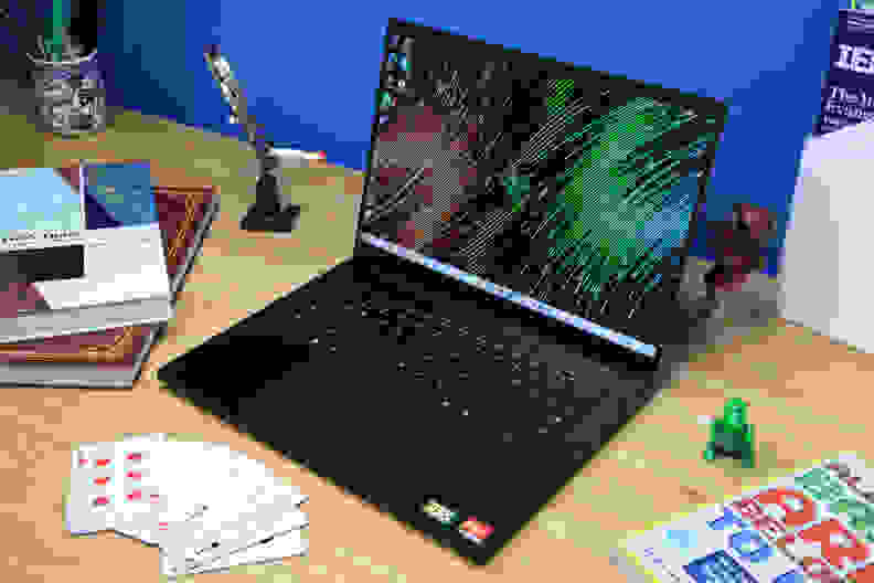 An open and powered on laptop showing a colorful screen.