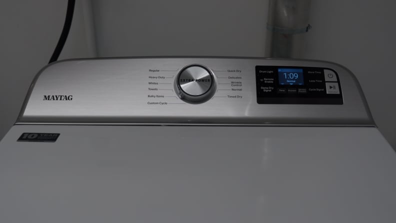 A close-up of the back panel on the dryer, which features standard dryer controls.