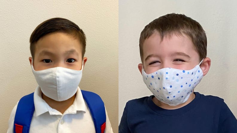 Two young children wearing face masks.