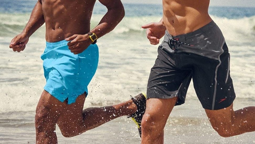 men running in Speedo swim trunks