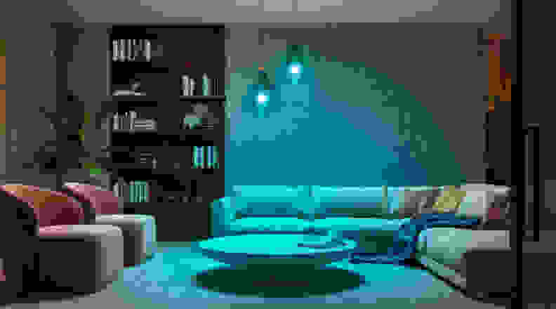 A well-decorated living room with two pendant lights featuring blue lights