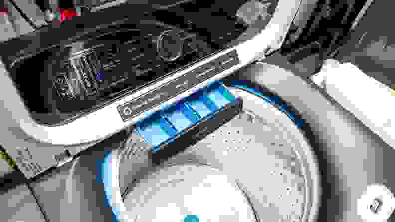 Product shot of the detergent dispenser inside of the GE Profile PTW900BPTRS washing machine.