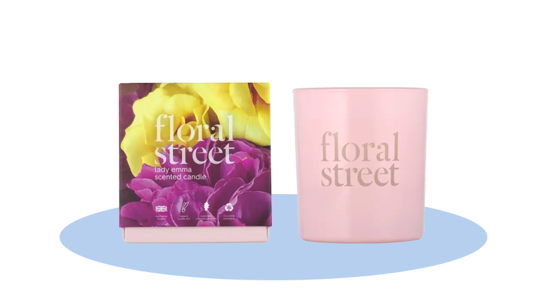 The Floral Street Lady Emma scented candle in front of a background.