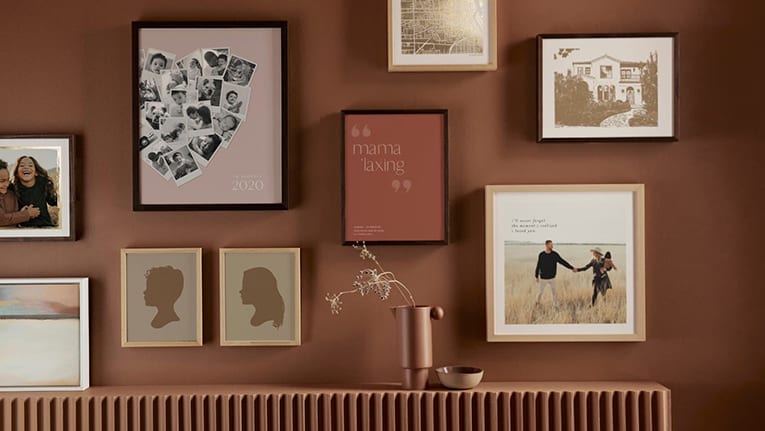 Frames photos on red wall