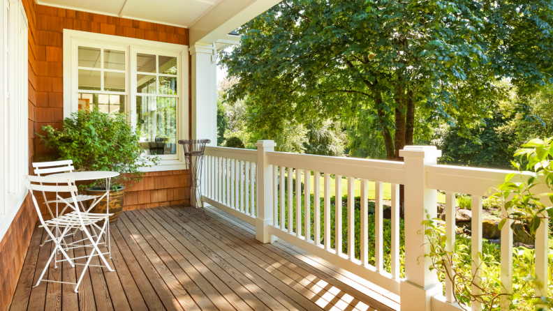 Spacious front porch of house on a sunny day.