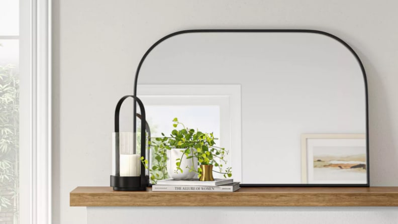 Japandi-style mirror on a mantle