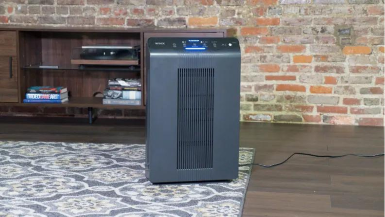 A Winix air purifier staged in a living space.