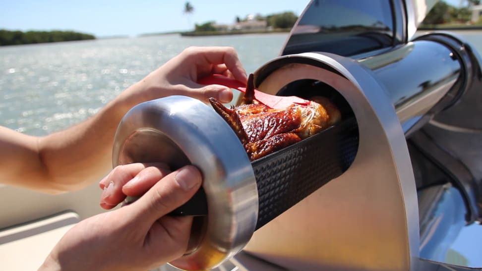 Meat cooking in a GoSun Grill.