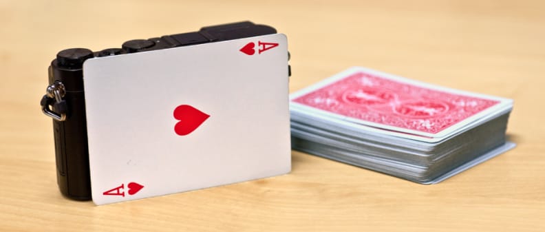 A photo of the Panasonic Lumix GM5 compared to a deck of cards.
