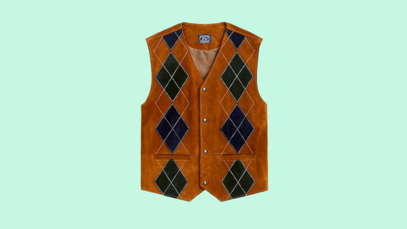 A suede vest with argyle print against a green background.