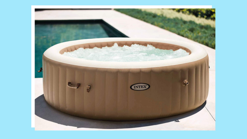 Inflatable hot tub pool next to in-ground pool outdoors.