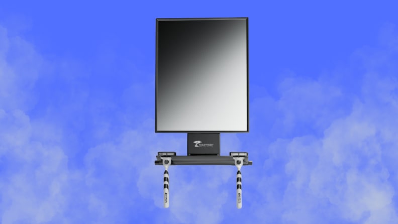 A shower mirror sits on a steamy blue background background