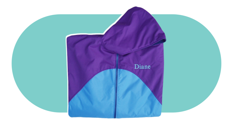 An Adaptations By Adrian Waterproof Breathable Winter or Rain Cape on a colorful background