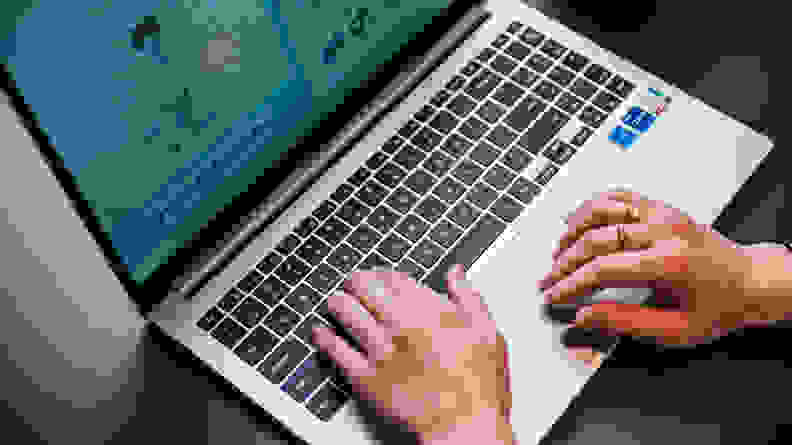 Hands typing on a keyboard