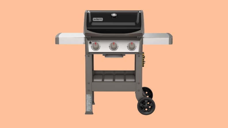 Gas grill against peach background