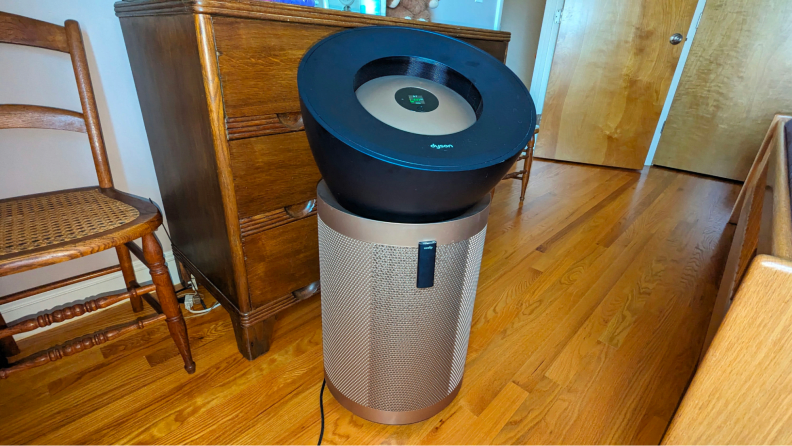 The Dyson Big and Quiet, the best air purifier for VOCs, appears in a wood furnished room.