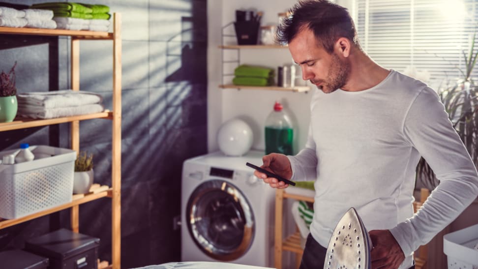 A person waits for a load of laundry to be done.