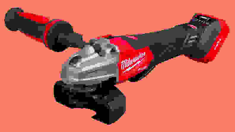 A close-up of the Milwaukee die grinder on a salmon-colored background.