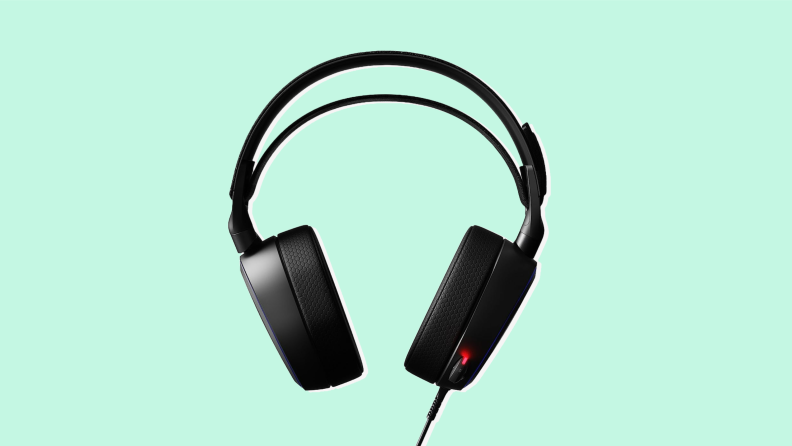 A SteelSeries Arctis Pro gaming headset on a green background