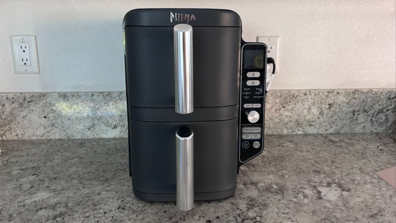 The Ninja Double Stack XL Air Fryer on a countertop surface.