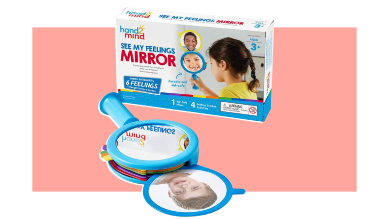 Box packaging of the See My Feelings Mirror next to mirror itself laying flat.