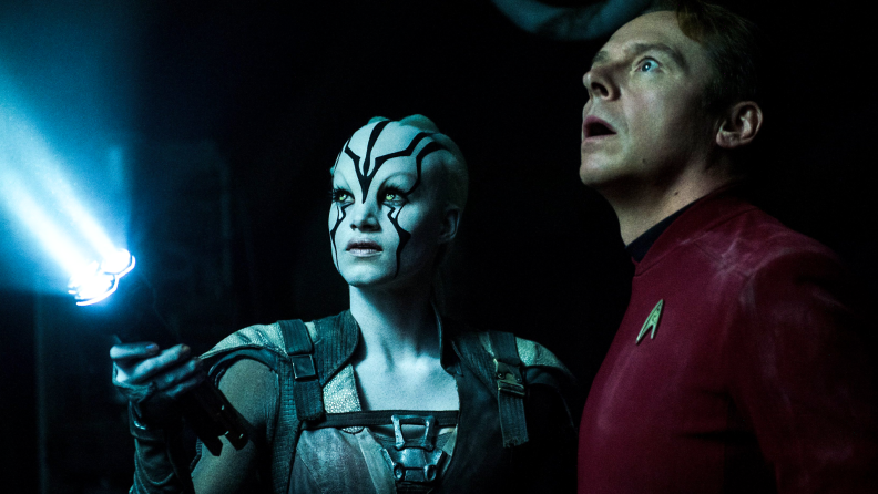 Sofia Boutella (in heavy space-alien makeup) and Simon Pegg explore the darkness with a flashlight in 2016’s Star Trek Beyond.