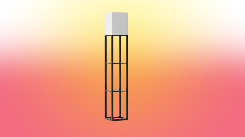 A lamp stands on a red and yellow fade background