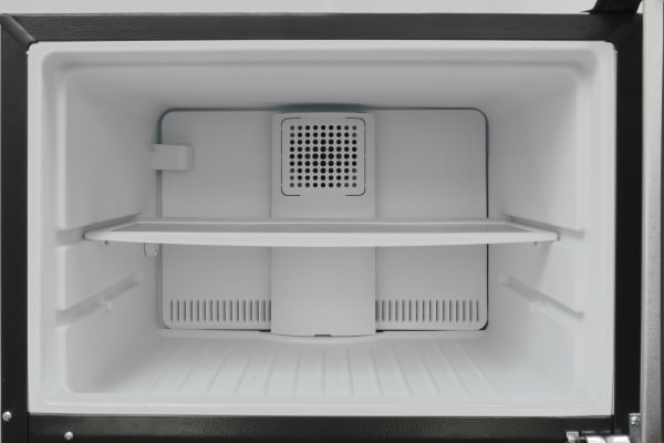Inside the GE GAS18P's freezer, you get one adjustable shelf. No light, no ice maker; it's very basic.