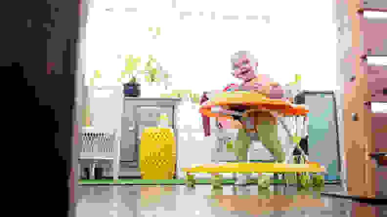 A child plays in a walker
