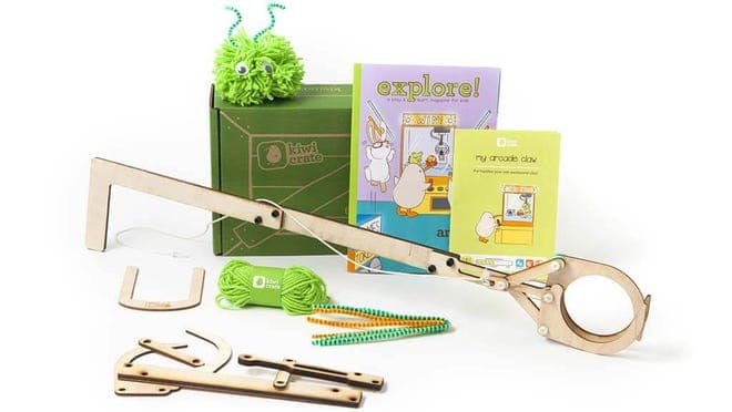 Children's craft set with assorted items and books.